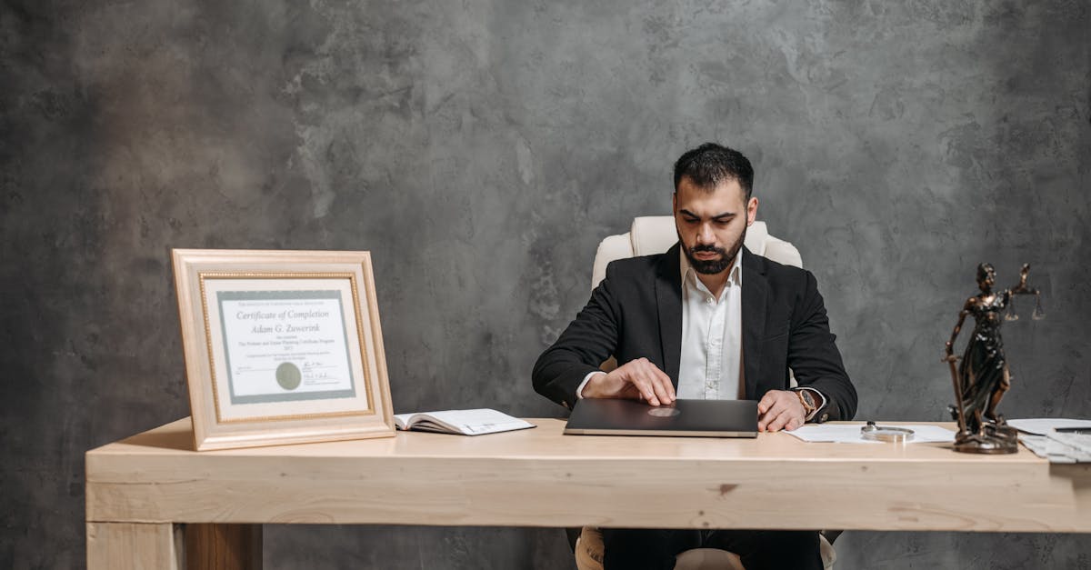 a bearded lawyer working at his office desk showing professionalism and expertise
